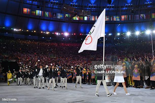 Refugee Olympic Team's flag bearer Rose Nathike Lokonyen leads the delegation during the opening ceremony of the Rio 2016 Olympic Games at the...