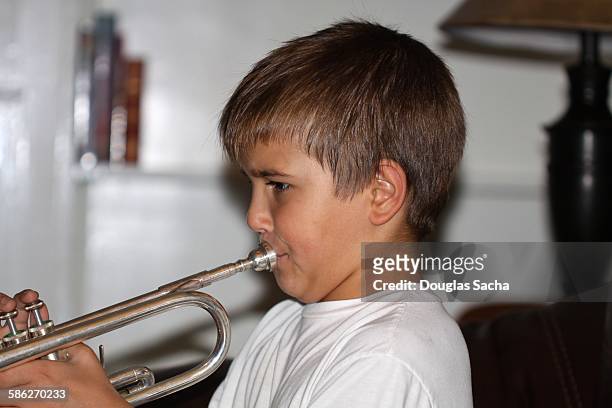 Teenage Boy Playing Trumpet Side View High-Res Stock Photo - Getty Images