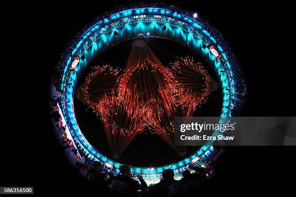 Fireworks explode to form the Olympic Rings during the Opening Ceremony of the Rio 2016 Olympic Games at Maracana Stadium on August 5, 2016 in Rio de...