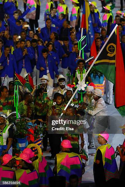 Flag bearer Yoshua Shing of Vanuatu leads his Olympic Team during the Opening Ceremony of the Rio 2016 Olympic Games at Maracana Stadium on August 5,...