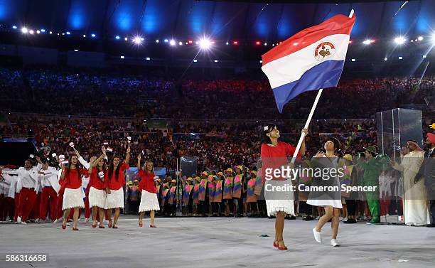Flag bearer Julieta Granada of Paraguay leads the team entering the stadium during the Opening Ceremony of the Rio 2016 Olympic Games at Maracana...