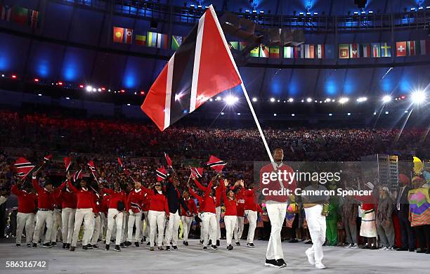Kenshorn Walcott of Trinidad and Tobago carries the flag during the Opening Ceremony of the Rio 2016 Olympic Games at Maracana Stadium on August 5,...