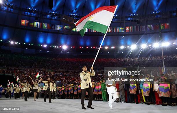 Dilshod Nazarov of Tajikistan carries the flag during the Opening Ceremony of the Rio 2016 Olympic Games at Maracana Stadium on August 5, 2016 in Rio...