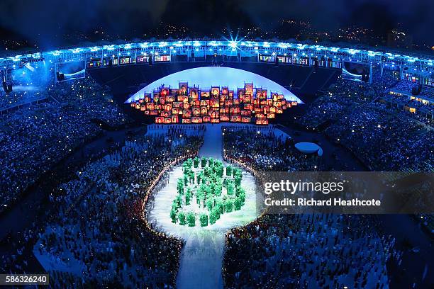 The Olympic Rings are formed in green foliage during the Opening Ceremony of the Rio 2016 Olympic Games at Maracana Stadium on August 5, 2016 in Rio...