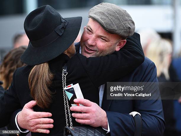 Owner Peter Moody is congratulated by another part owner after Ulmann won Race 5, during Melbourne racing at Flemington Racecourse on August 6, 2016...