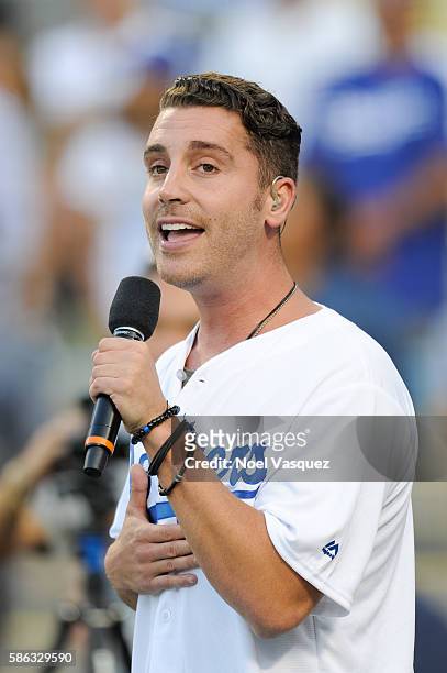 Nick Fradiani performs the national anthem prior to a baseball game between the Boston Red Sox and the Los Angeles Dodgers at Dodger Stadium on...