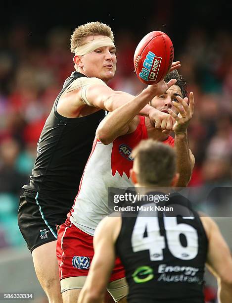 Ollie Wines of the Power spoils a mark for Josh P Kennedy of the Swans during the round 20 AFL match between the Sydney Swans and the Port Adelaide...