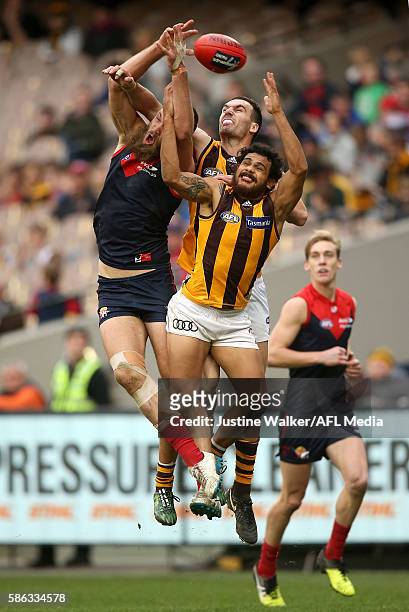 Cyril Rioli of the Hawks contests the mark with Max Gawn of the Demons during the 2016 AFL Round 20 match between the Melbourne Demons and the...