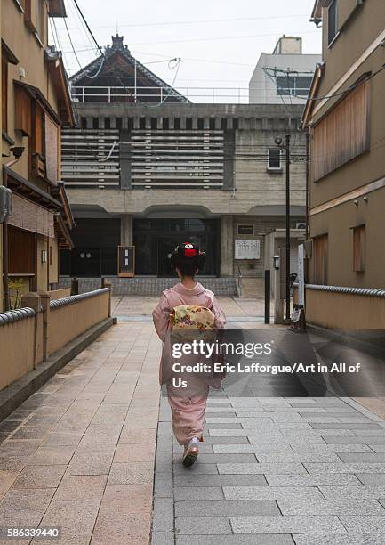 Years old maiko called chikasaya walking in the streets of gion, kansai region, kyoto, Japan on May 27, 2016 in Kyoto, Japan.