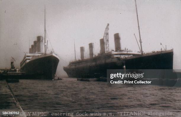 Olympic' entering dock with S.S. 'Titanic' alongside', Belfast, 2 March 1912. Titanic is under construction whilst the Olympic has been brought into...