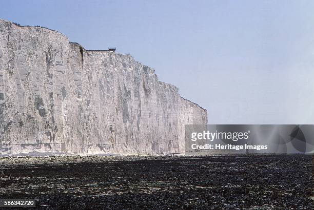 Chalk Cliffs and Lighthouse at Beachy Head, Sussex, 20th century. Chalk headland in East Sussex, England formed in the Late Cretaceous, between 66...