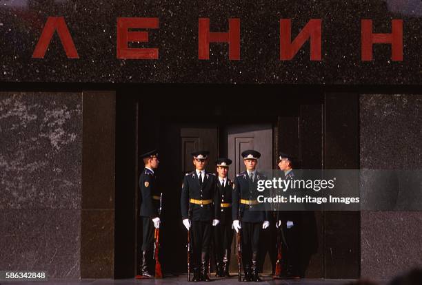 Changing Guard at Lenins Tomb, Red Square, Moscow, 20th century. Armed police and military guards at doorway to mausoleum and resting place of...