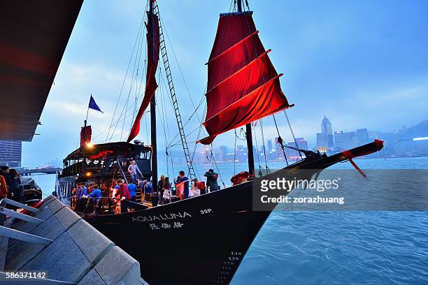 tourist junk ship in victoria harbour, hong kong - hong kong junk boat stock pictures, royalty-free photos & images