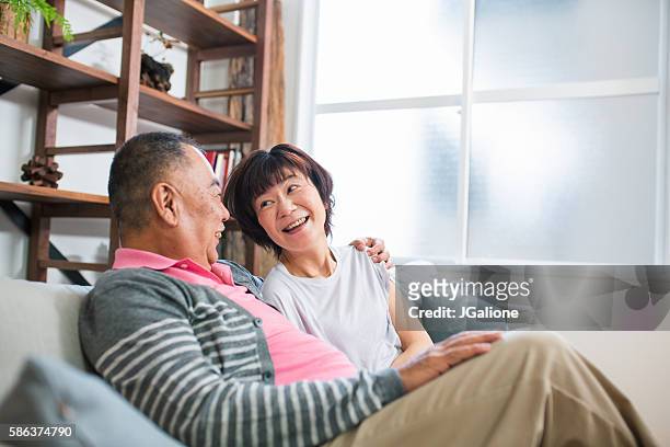senior couple relaxing together - wedding anniversary stockfoto's en -beelden
