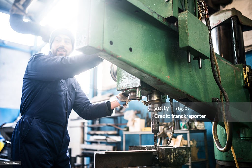 Industrial engineer at the lathe machine