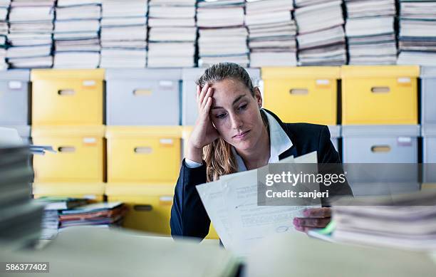 tired businesswoman in the office - paperwork frustration stock pictures, royalty-free photos & images