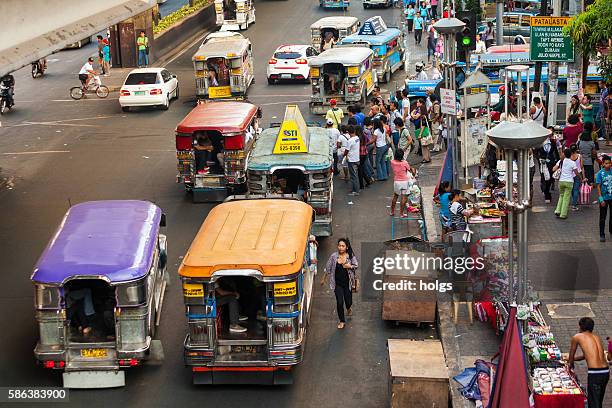 jeepneys in manila, philippines - philippines jeepney stock pictures, royalty-free photos & images