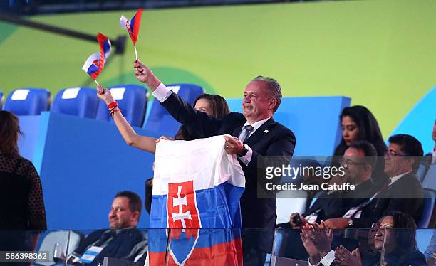 President of Slovakia Andrej Kiska waves to the slovakian delegation during the opening ceremony of the 2016 Summer Olympics at Maracana Stadium on...