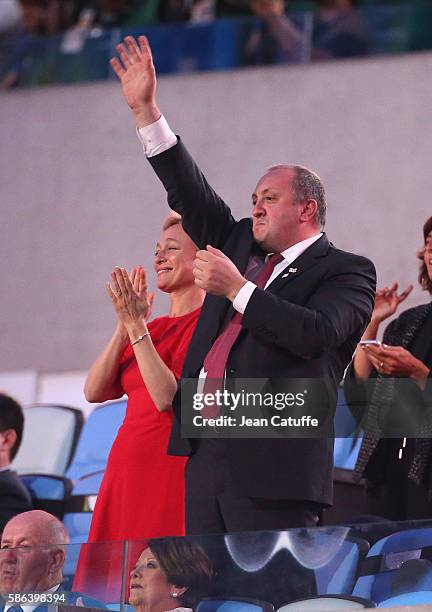 President of Georgia Giorgi Margvelashvili and Maka Chichua wave to the Georgian delegation during the opening ceremony of the 2016 Summer Olympics...