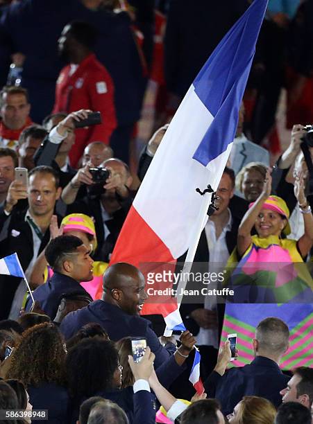 Flag bearer of France Teddy Riner leads the French delegation during the opening ceremony of the 2016 Summer Olympics at Maracana Stadium on August...