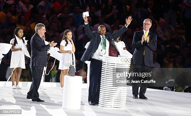 President Thomas Bach presents the Olympic Laurel to Kip Keino of Kenya while Carlos Nuzman looks on during the opening ceremony of the 2016 Summer...