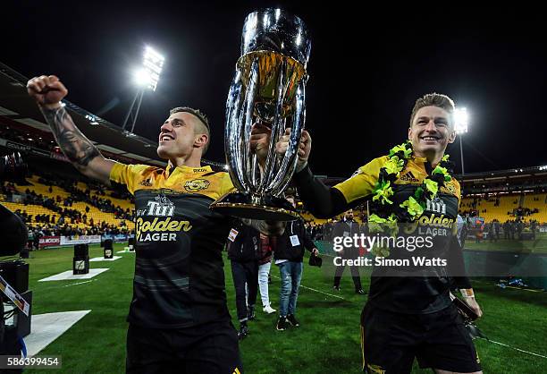 Perenara and Beauden Barrett of the Hurricanes celebrate with the Super Rugby Trophy after the Hurricanes won the 2016 Super Rugby Final match...