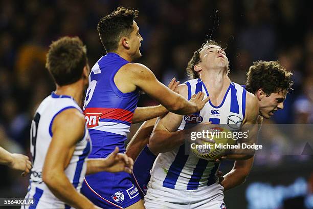 Joel Hamling of the Bulldogs crunches Trent Dumont of the Kangaroos after he marked the ball during the round 20 AFL match between the Western...