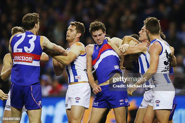 Joel Hamling of the Bulldogs is invloved in a melee after he crunched Trent Dumont of the Kangaroos during the round 20 AFL match between the Western...