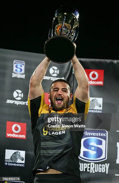 Danes Coles of the Hurricanes hoists the Super Rugby Trophy after the Hurricanes won the 2016 Super Rugby Final match between the Hurricanes and the...