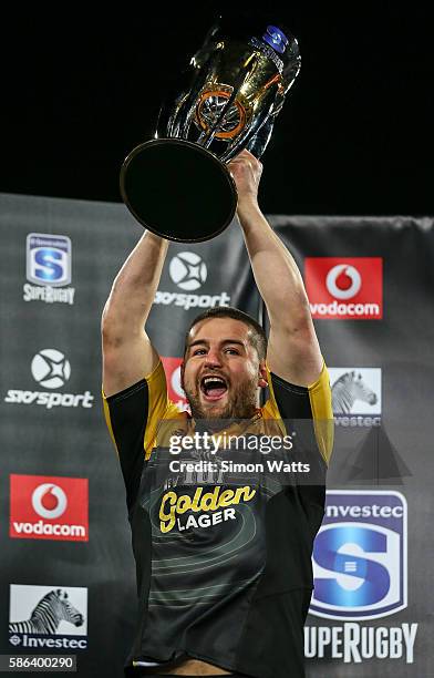 Danes Coles of the Hurricanes hoists the Super Rugby Trophy after the Hurricanes won the 2016 Super Rugby Final match between the Hurricanes and the...