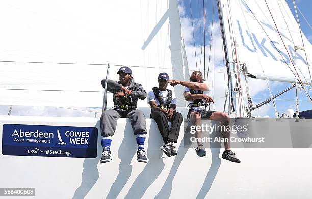 Reagan Joepeph-Henry and Kirk Read and Elroy Palmer of St. Giles Trust sail during Aberdeen Asset Management Cowes Week on August 6, 2016 in Cowes,...