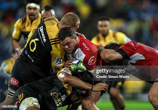 Dylan Smith of the Lions is tackled during the 2016 Super Rugby Final match between the Hurricanes and the Lions at Westpac Stadium on August 6, 2016...