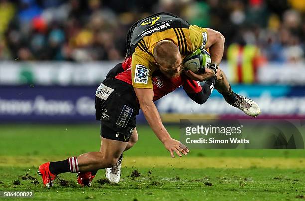 Brad Shields of the Hurricanes is tackled during the 2016 Super Rugby Final match between the Hurricanes and the Lions at Westpac Stadium on August...