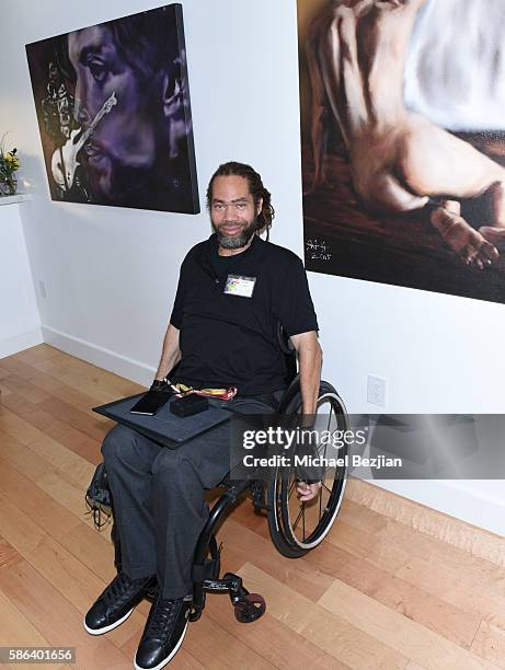 Artist Richard Bell poses with artwork at Artists For Trauma Adaptive Artist Multi-Media Group Art Show on August 5, 2016 in Redondo Beach,...