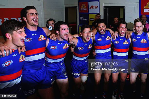 Bulldogs players sing the club song after winning during the round 20 AFL match between the Western Bulldogs and the North Melbourne Kangaroos at...