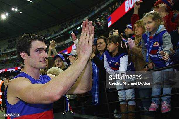 Easton Wood of the Bulldogs celebrates the win with fans during the round 20 AFL match between the Western Bulldogs and the North Melbourne Kangaroos...