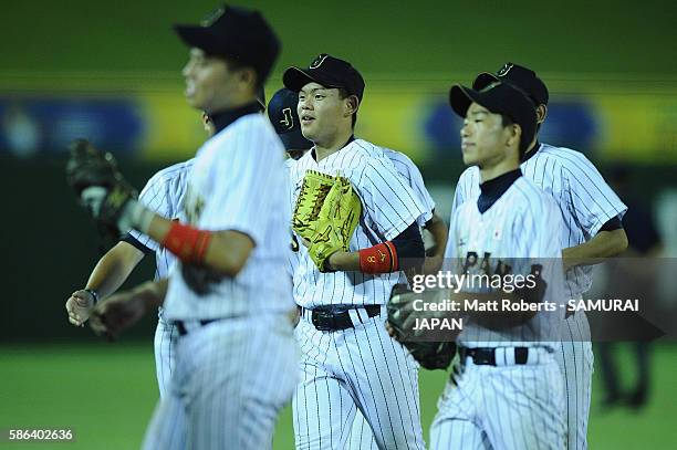 Kenji Inoh of Japan runs to the dugout in the top half of the eighth inning in the super round game between Japan and Panama during The 3rd WBSC U-15...