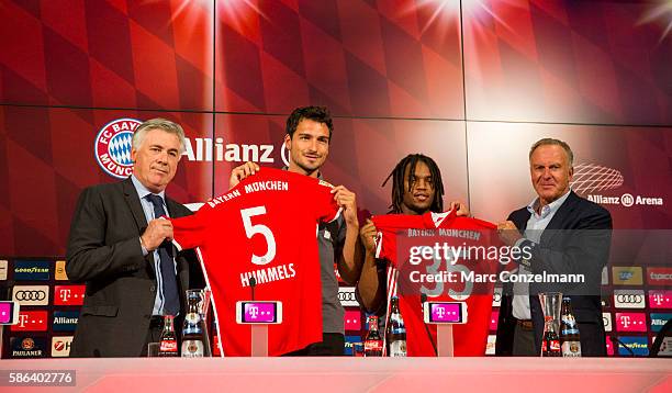 Carlo Ancelotti, Mats Hummels, Renato Sanches and Karl-Heinz Rummenigge are seen during a press conference of FC Bayern Munich at Allianz Arena on...