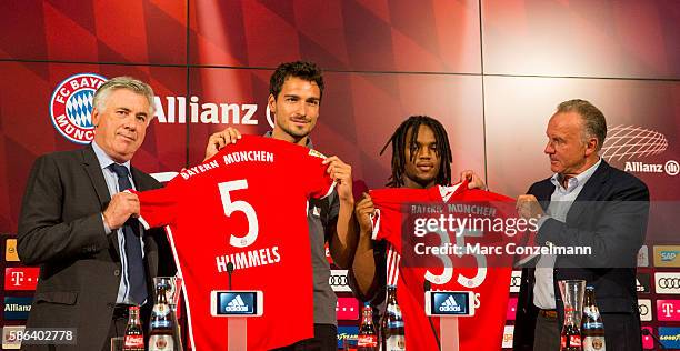 Carlo Ancelotti, Mats Hummels, Renato Sanches and Karl-Heinz Rummenigge are seen during a press conference of FC Bayern Munich at Allianz Arena on...