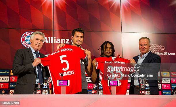 Carlo Ancelotti, Mats Hummels, Renato Sanches and Karl-Heinz Rummenigge are seen during a press conference of FC Bayern Munich at Allianz Arena on...