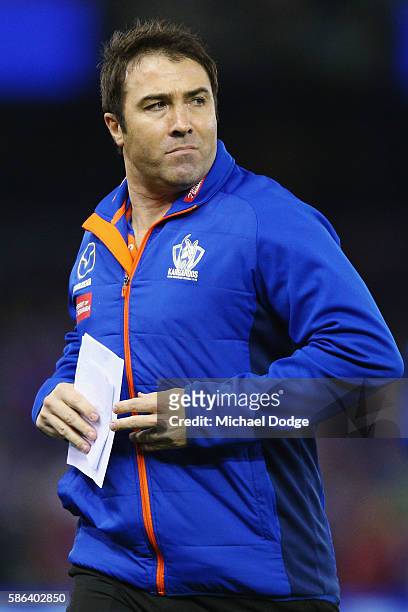Kangaroos head coach Brad Scott runs off at at quarter time during the round 20 AFL match between the Western Bulldogs and the North Melbourne...