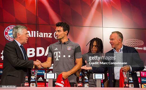 Carlo Ancelotti, Mats Hummels, Renato Sanches and Karl-Heinz Rummenigge attend a press conference of FC Bayern Munich at Allianz Arena on August 6,...