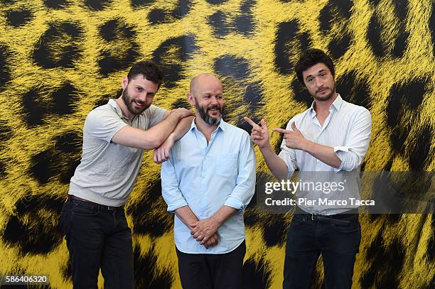 Actor Mikael Zimmerman, director Gilles Marchand and actor Jeremie Elkaim attends 'Dans la foret' photocall during the 69th Locarno Film Festival on...