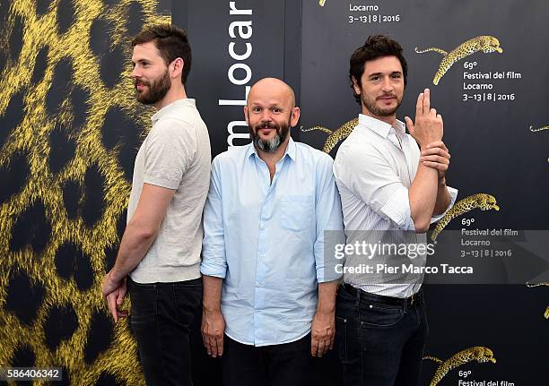 Actor Mikael Zimmerman, director Gilles Marchand and actor Jeremie Elkaim attends 'Dans la foret' photocall during the 69th Locarno Film Festival on...