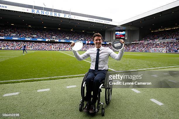 Gordon Reid British wheelchair tennis player with his Wimbledon and French Open trophies during half time in the Ladbrokes Scottish Premiership match...