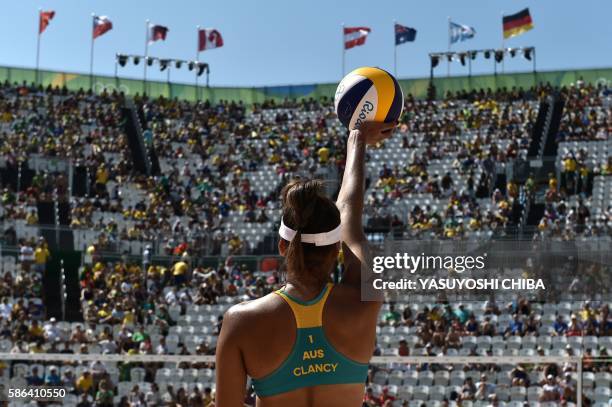 Australia's Taliqua Clancy prepares to serve the ball during the women's beach volleyball qualifying match between Australia and Costa Rica at the...