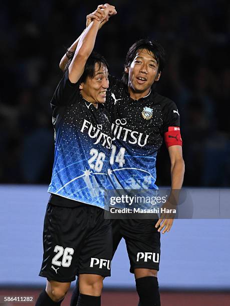 Koji Miyoshi and Kengo Nakamura of Kawasaki Frontale celebrate their second goal during the J.League match between Kawasaki Frontale and Ventforet...