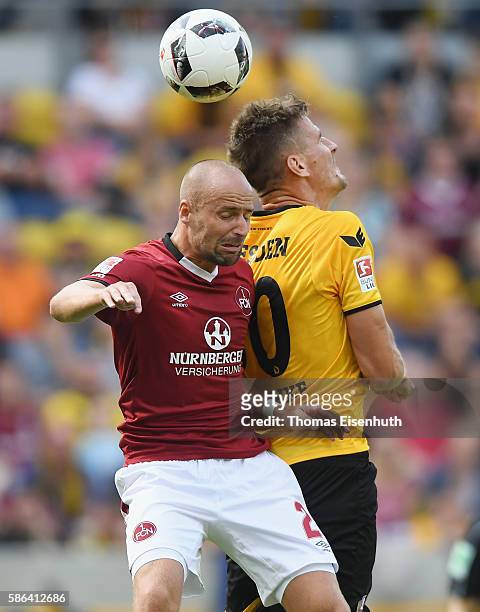 Stefan Kutschke of Dresden is challenged by Miso Brecko of Nuernberg during the Second Bundesliga match between SG Dynamo Dresden and 1. FC Nuernberg...
