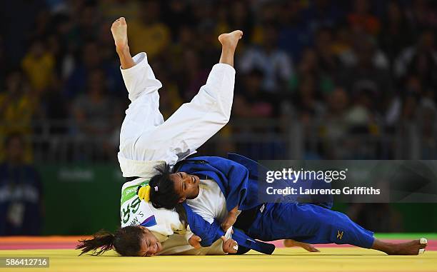 Dayaris Mestre Alvarez of Cuba competes against Sarah Menezes of Brazil in the Women's -48 kg Judo on Day 1 of the Rio 2016 Olympic Games at Carioca...