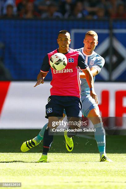 Bobby Wood of Hamburg challenges Ryan Shawcross of Stoke City during the pre-season friendly match between Hamburger SV and Stoke City at...